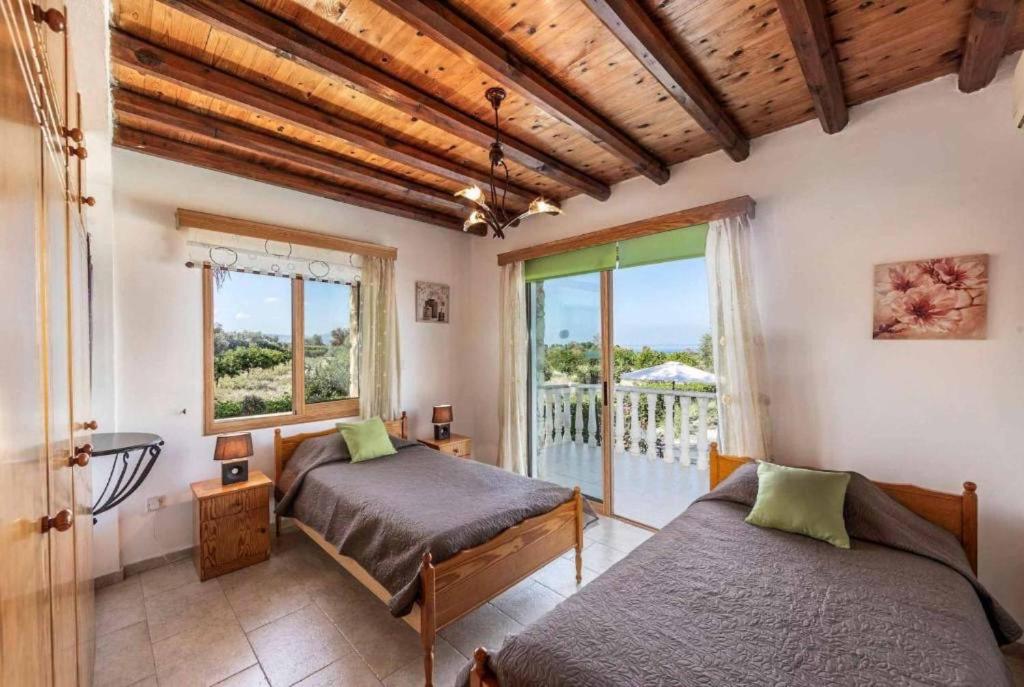 Postel nebo postele na pokoji v ubytování Villa Antonis
