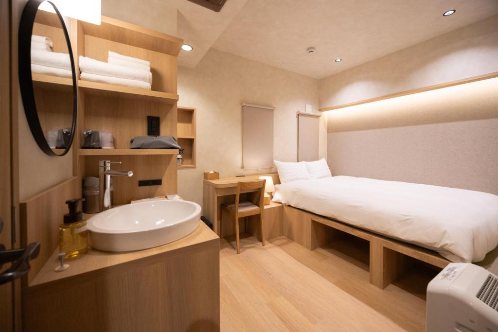 Postel nebo postele na pokoji v ubytování Hotel Paul House