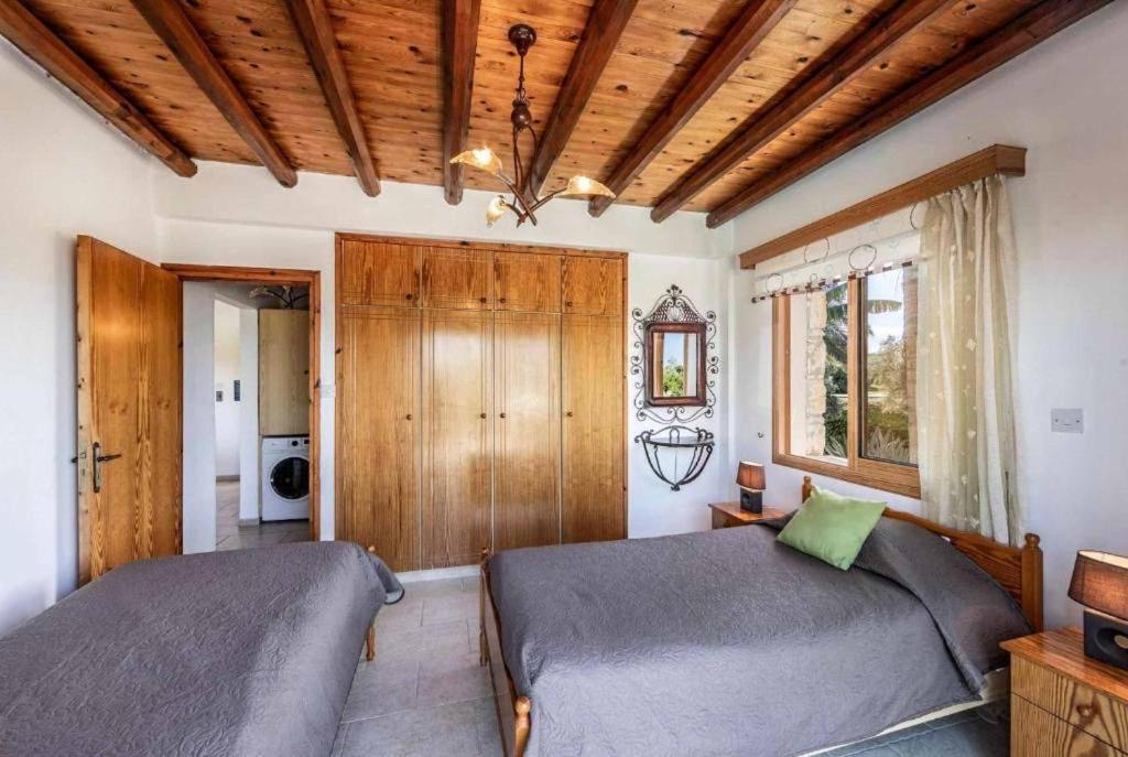 Postel nebo postele na pokoji v ubytování Villa Antonis