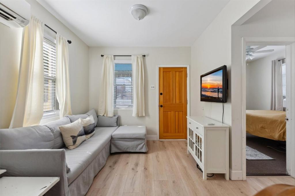 a living room with a couch and a television at 108 W 20Th Ave, Unit 2 in North Wildwood