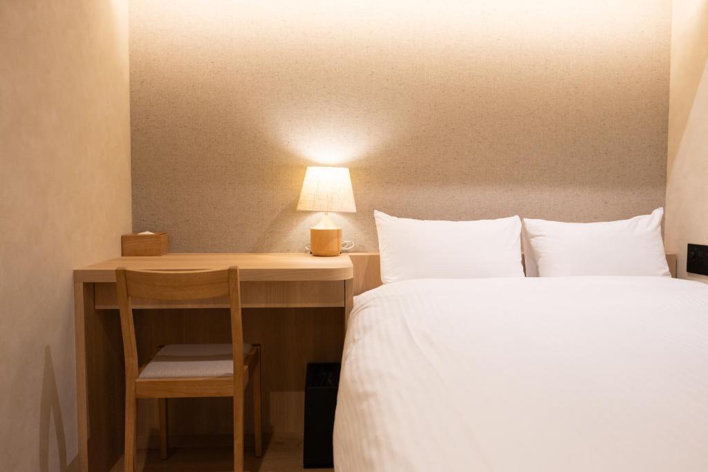 Postel nebo postele na pokoji v ubytování Hotel Paul House