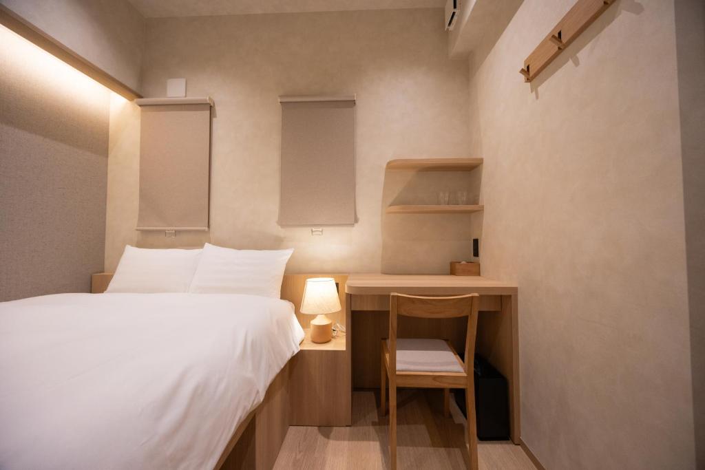Postel nebo postele na pokoji v ubytování Hotel Paul House
