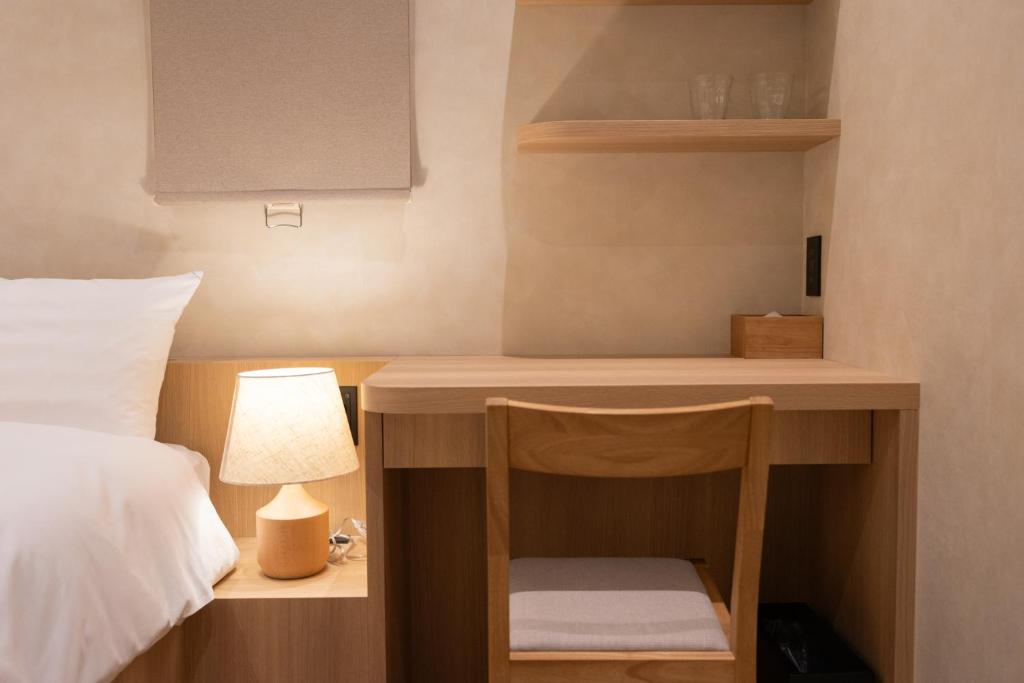 Postel nebo postele na pokoji v ubytování Hotel Paul House