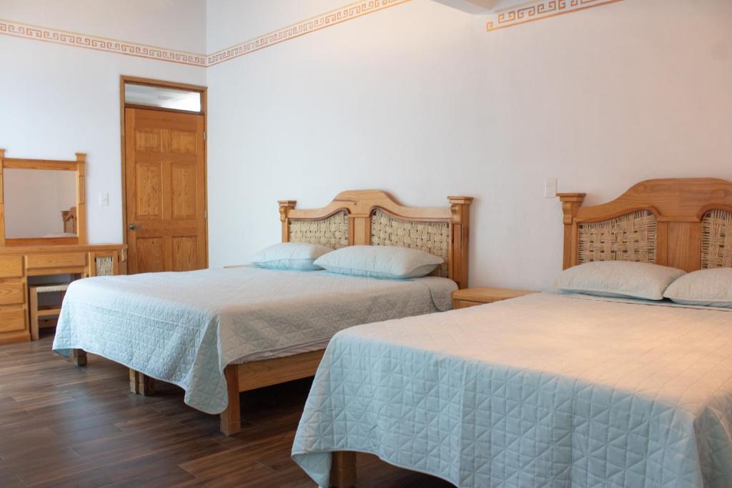 Letto o letti in una camera di Los Temazcales de Xochitepec