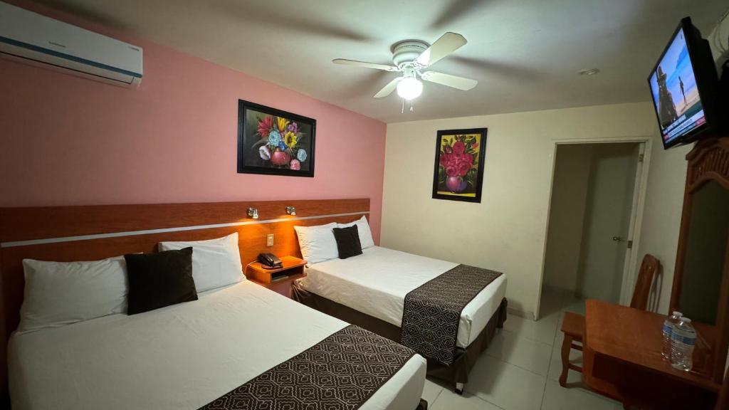 Postel nebo postele na pokoji v ubytování Hotel Ana Isabel