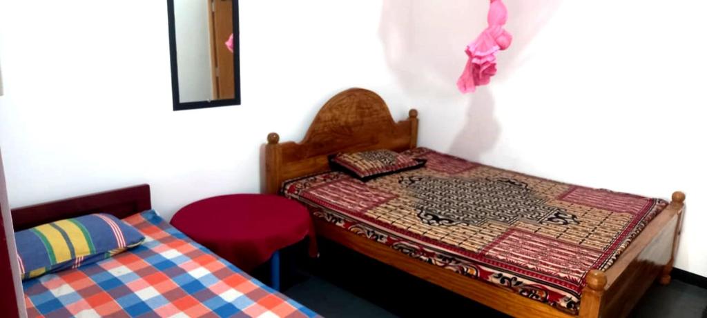 Postel nebo postele na pokoji v ubytování KBC Hotel & Guest House