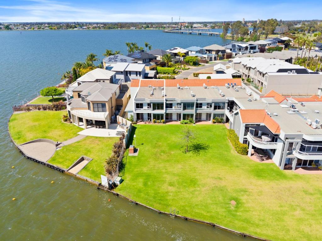 an aerial view of a house on a island in the water at Yarrawonga Lakeside Apartment 50 in Mulwala