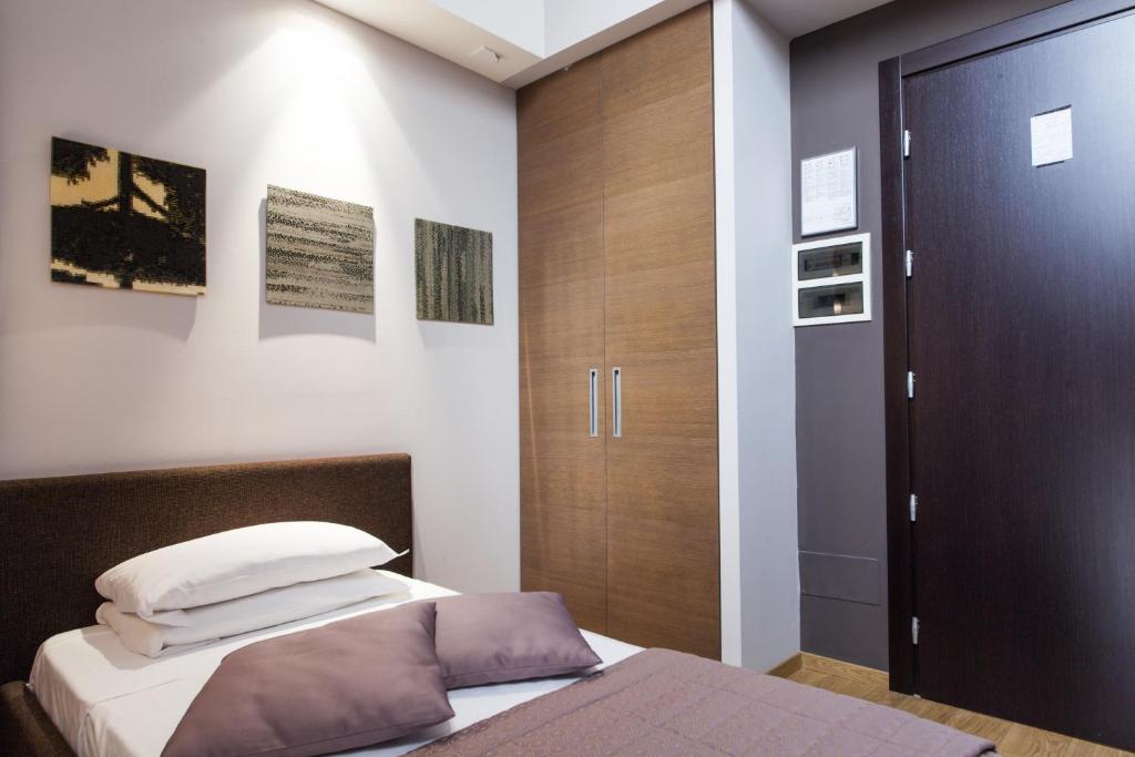 Postel nebo postele na pokoji v ubytování Hotel Michelangelo