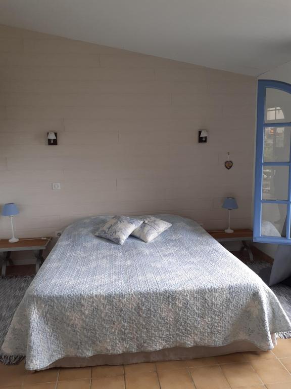 Postel nebo postele na pokoji v ubytování La Bleuette