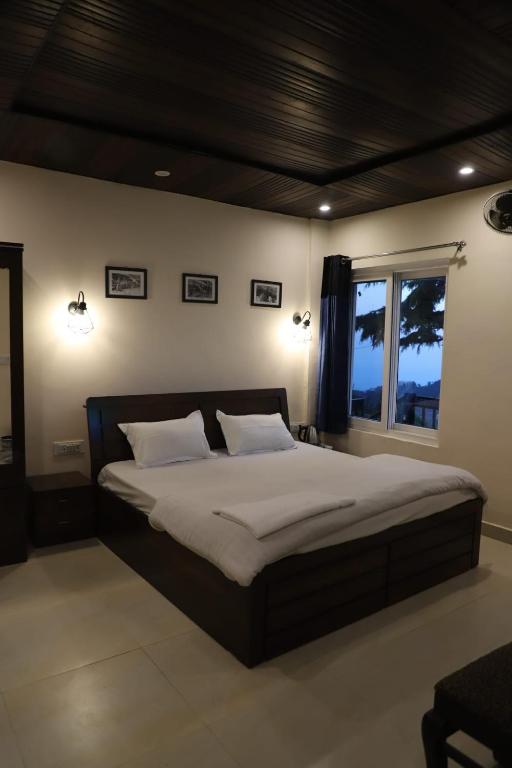 Postel nebo postele na pokoji v ubytování Himalayan view stay - Pahado wala ghar