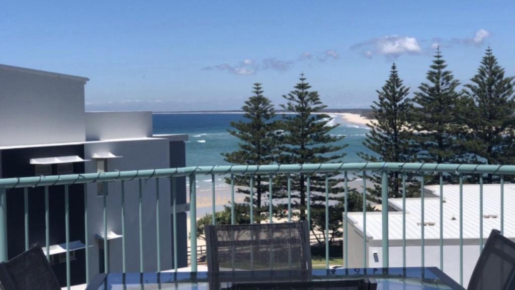 a balcony with a view of the ocean at Sandy Cove Unit 6 in Caloundra