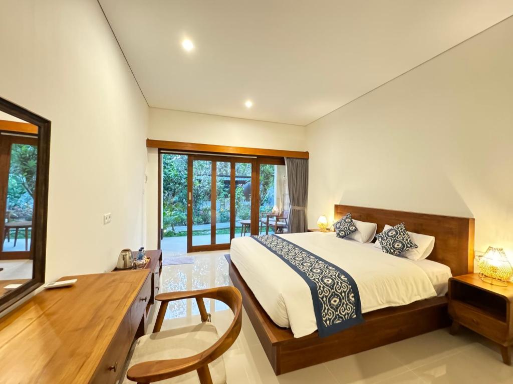 Postel nebo postele na pokoji v ubytování Puri Teduh Guesthouse Ubud