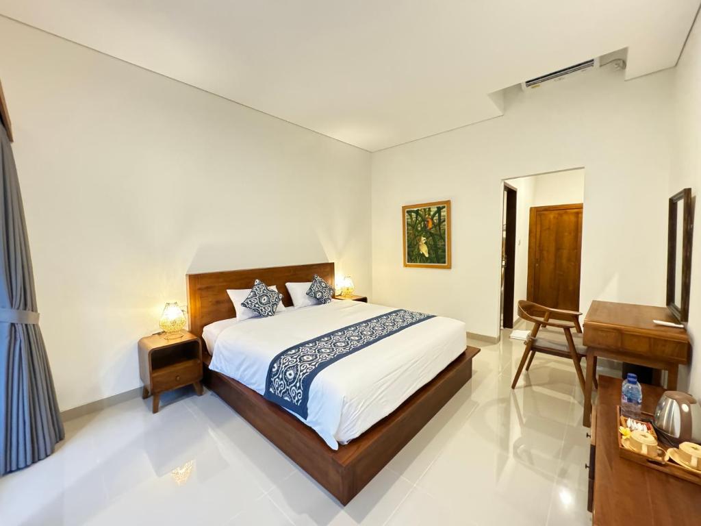 Postel nebo postele na pokoji v ubytování Puri Teduh Guesthouse Ubud