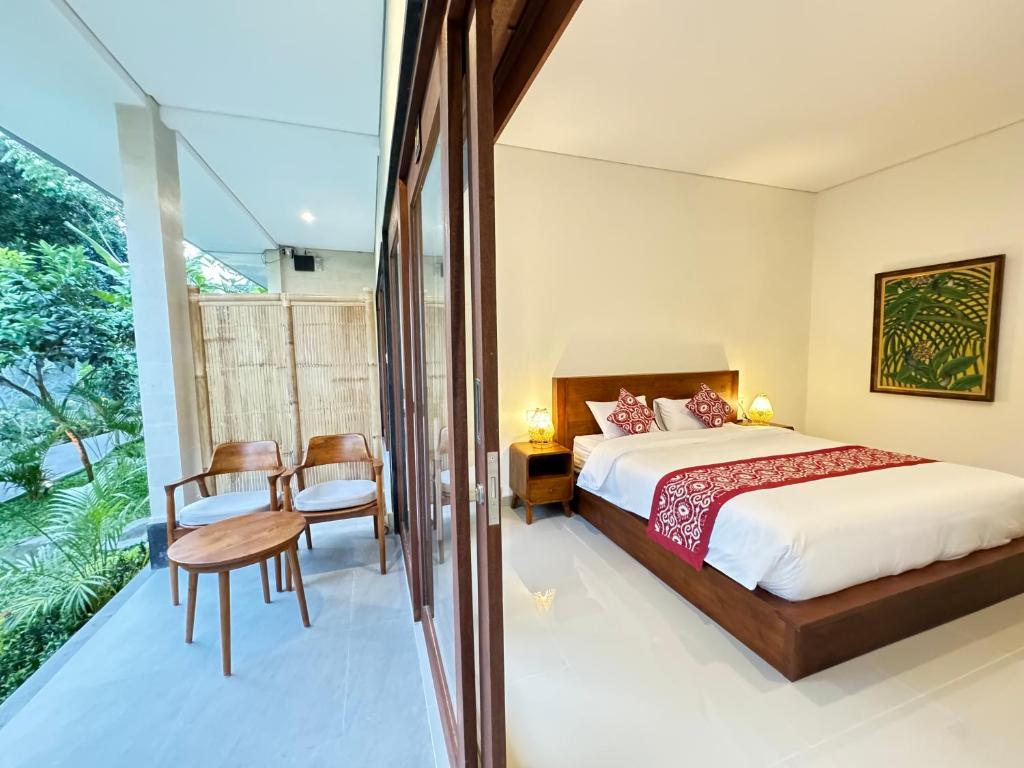Postel nebo postele na pokoji v ubytování Puri Teduh Guesthouse Ubud