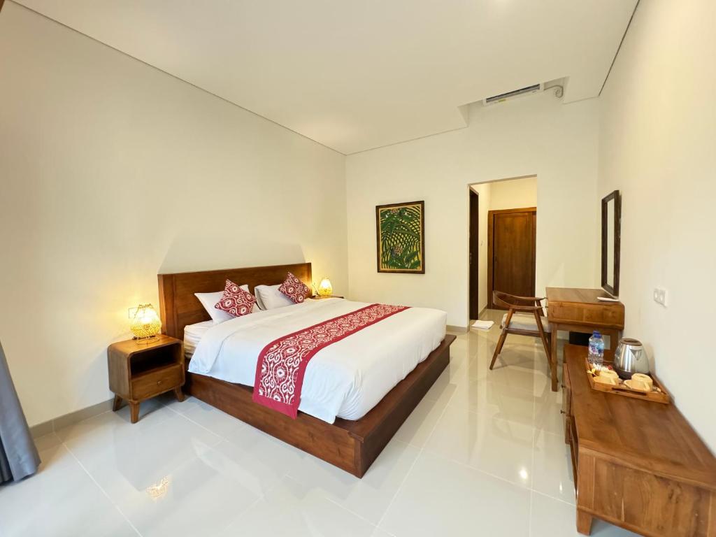 Postel nebo postele na pokoji v ubytování Puri Teduh Guesthouse Ubud
