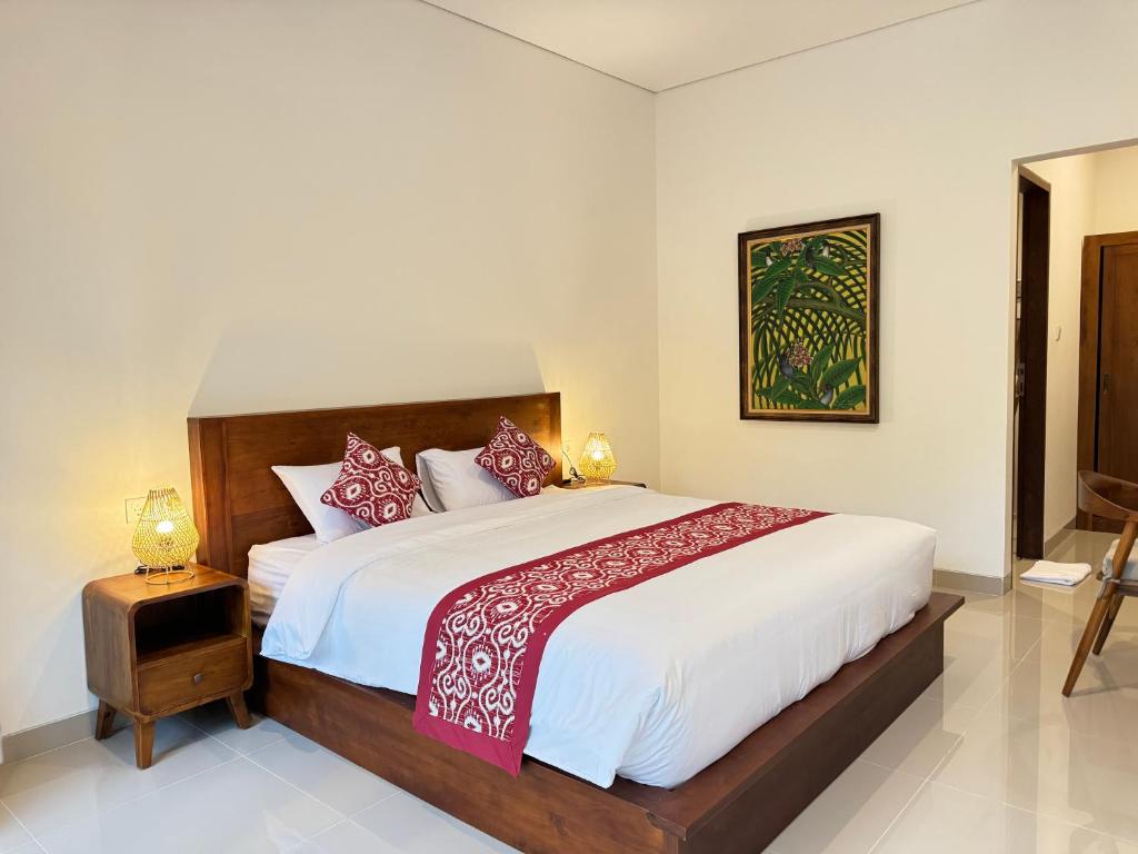 Postel nebo postele na pokoji v ubytování Puri Teduh Guesthouse Ubud