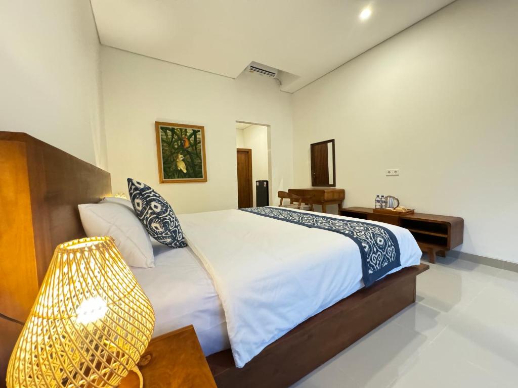 Postel nebo postele na pokoji v ubytování Puri Teduh Guesthouse Ubud