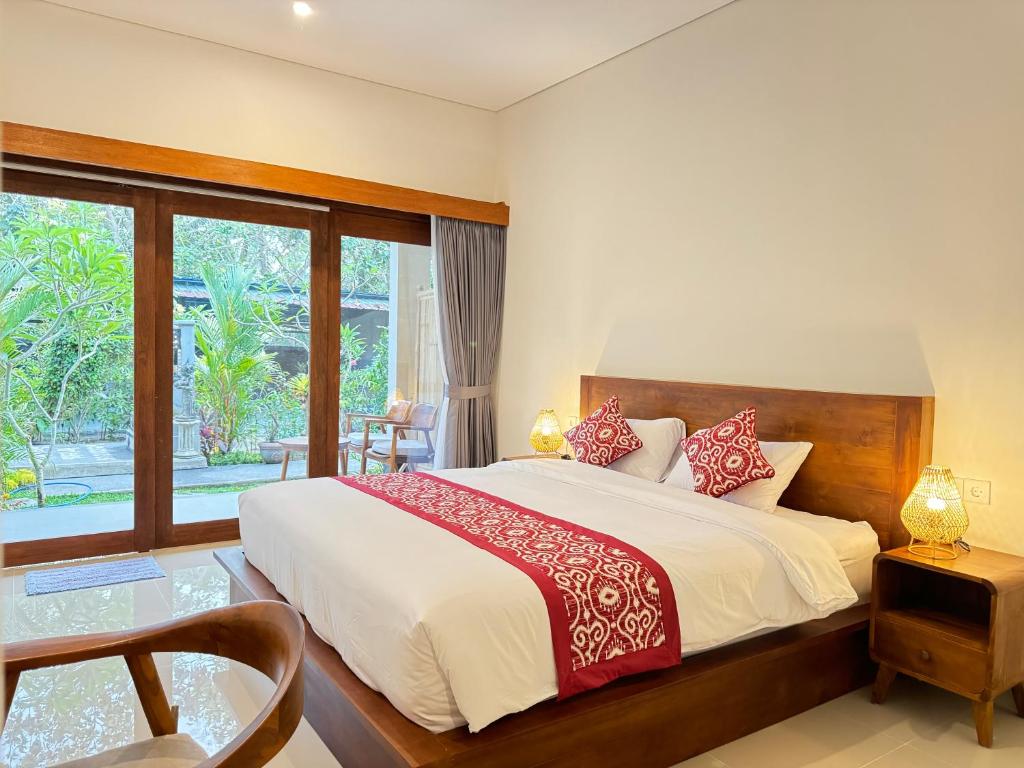 Postel nebo postele na pokoji v ubytování Puri Teduh Guesthouse Ubud