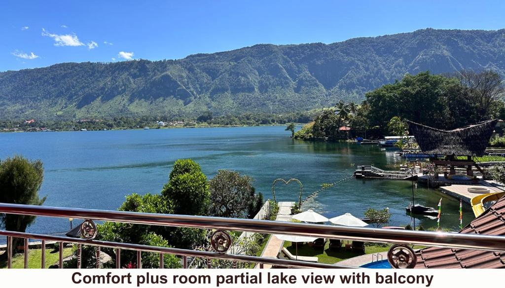 a view of a river with mountains in the background at Zoé’s Paradise Waterfront Hotel in Tuktuk Siadong