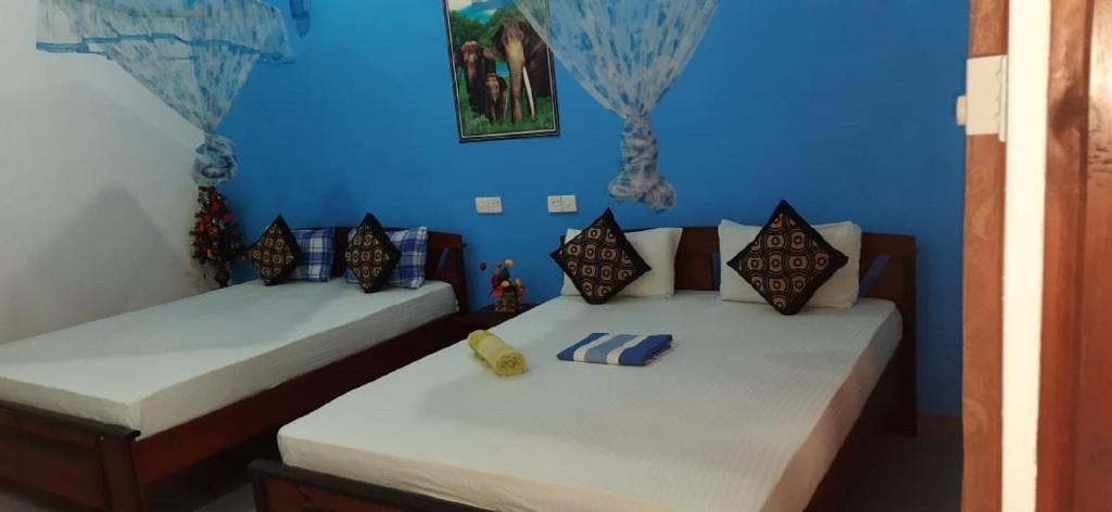 Postel nebo postele na pokoji v ubytování Sigiri Rangana Guesthouse