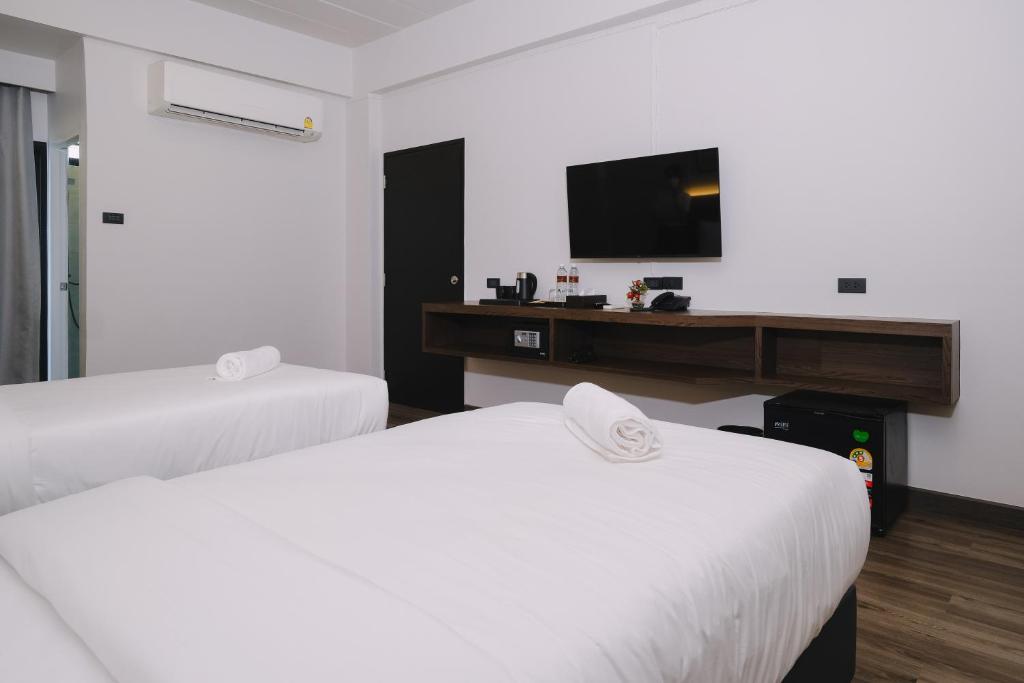 Postel nebo postele na pokoji v ubytování Raya Hotel Krabi
