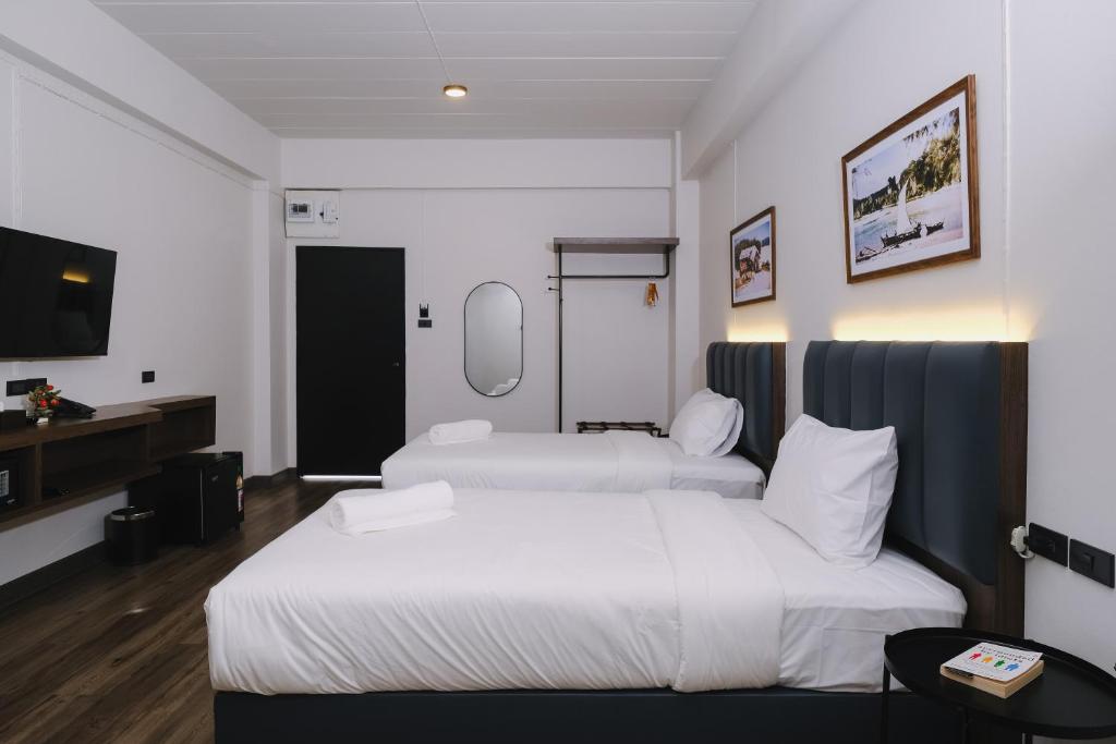 Postel nebo postele na pokoji v ubytování Raya Hotel Krabi