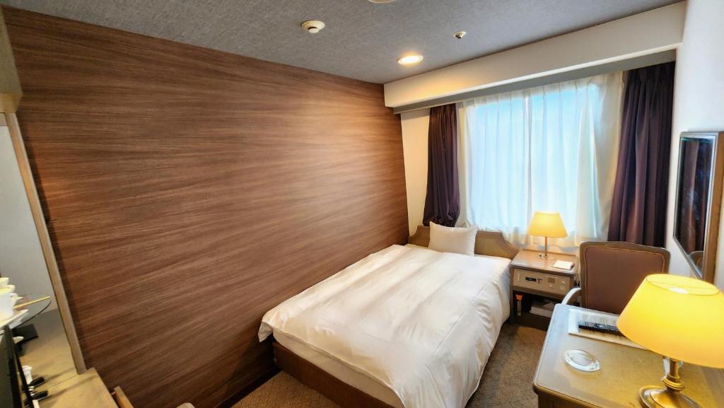 Letto o letti in una camera di Platon Hotel Yokkaichi