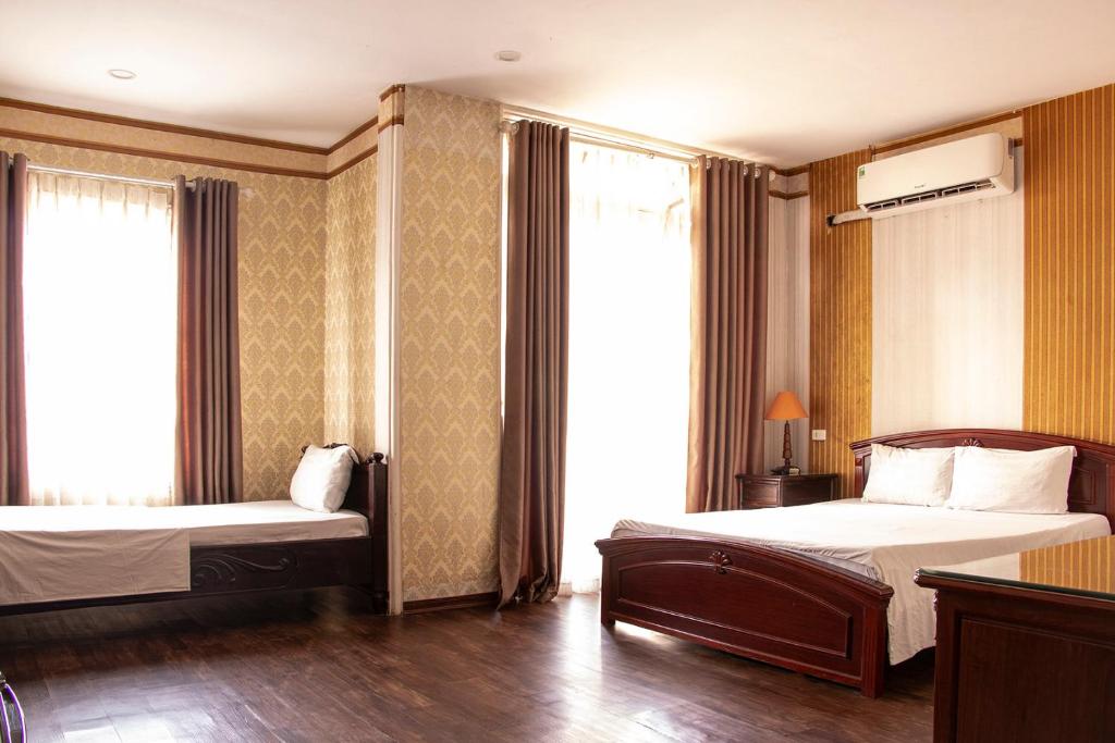 Postel nebo postele na pokoji v ubytování HomeTown Cha Hotel