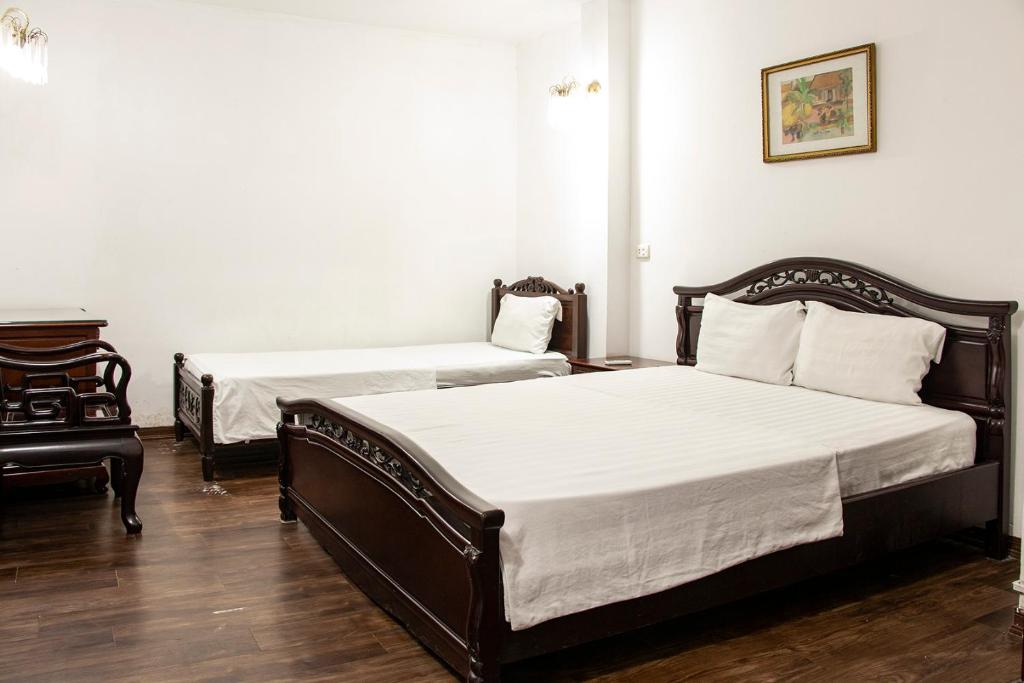 Postel nebo postele na pokoji v ubytování HomeTown Cha Hotel