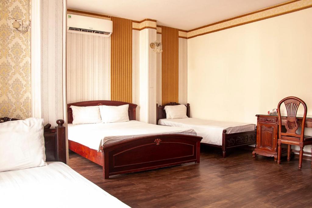 Postel nebo postele na pokoji v ubytování HomeTown Cha Hotel