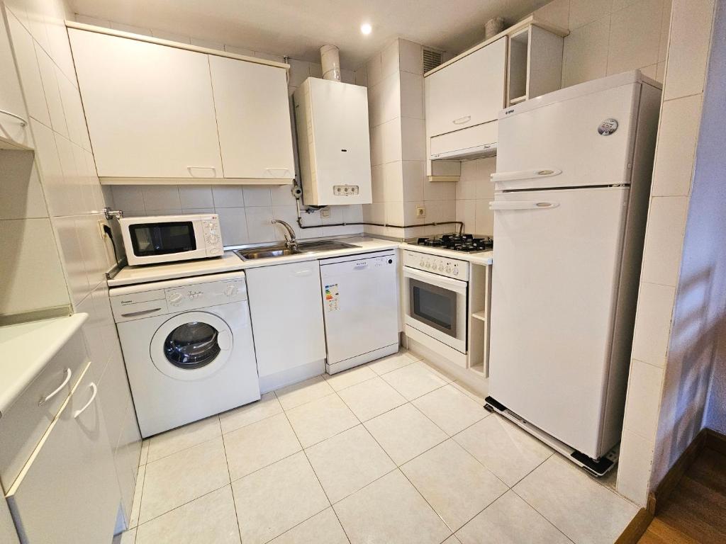 Kuchyň nebo kuchyňský kout v ubytování Apartamentos 3000 Formigal