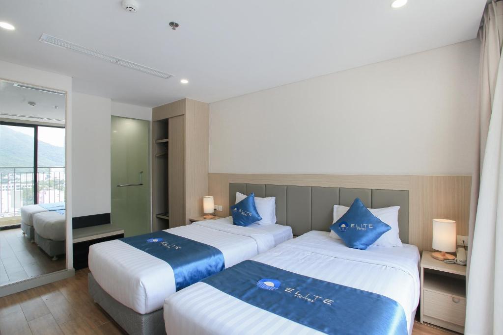 Giường trong phòng chung tại Elite Hotel Nha Trang