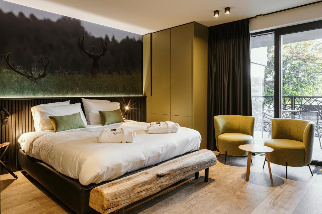 Postel nebo postele na pokoji v ubytování CC Nomie Hôtel Restaurant