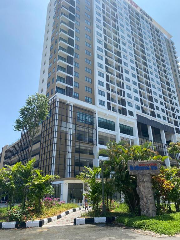 a tall building with trees in front of it at Sunway City Ipoh Tambun Onsen Cozy Retreat 8pax in Tambun