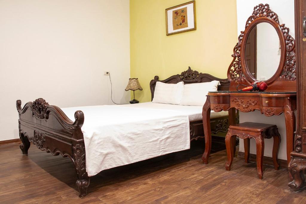 Postel nebo postele na pokoji v ubytování HomeTown Cha Hotel