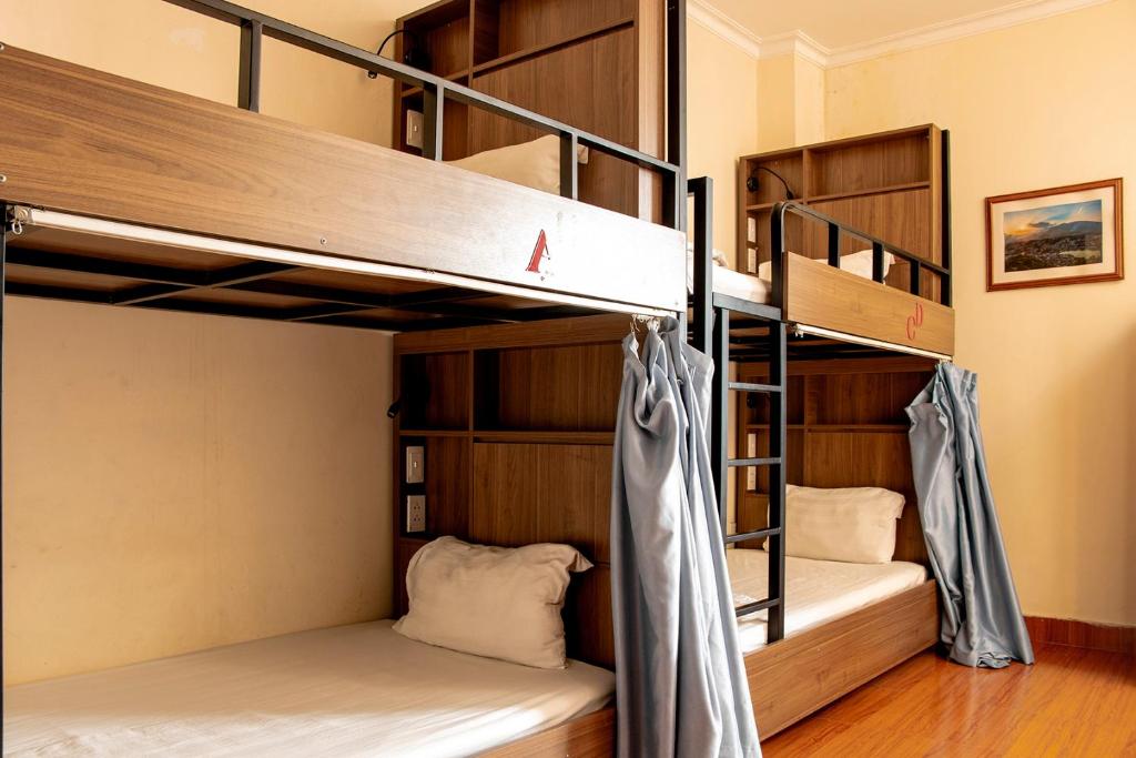 Postel nebo postele na pokoji v ubytování HomeTown Cha Hotel