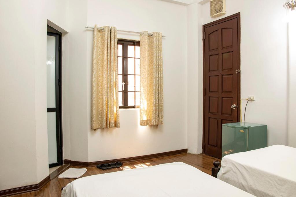 Postel nebo postele na pokoji v ubytování HomeTown Cha Hotel