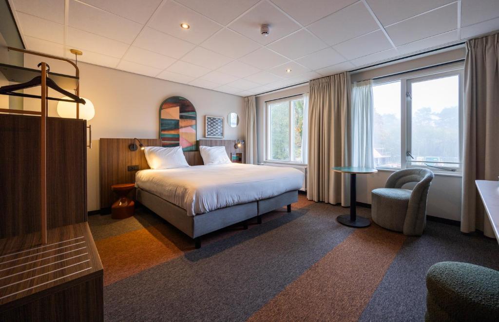 Postel nebo postele na pokoji v ubytování Fletcher Boutique Hotel De Mallejan