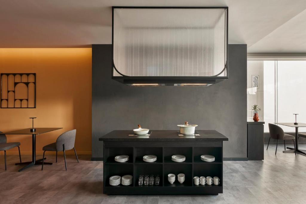 Khu vực ghế ngồi tại M Village Hotel Da Nang Centre - Free Laundry and Kitchen