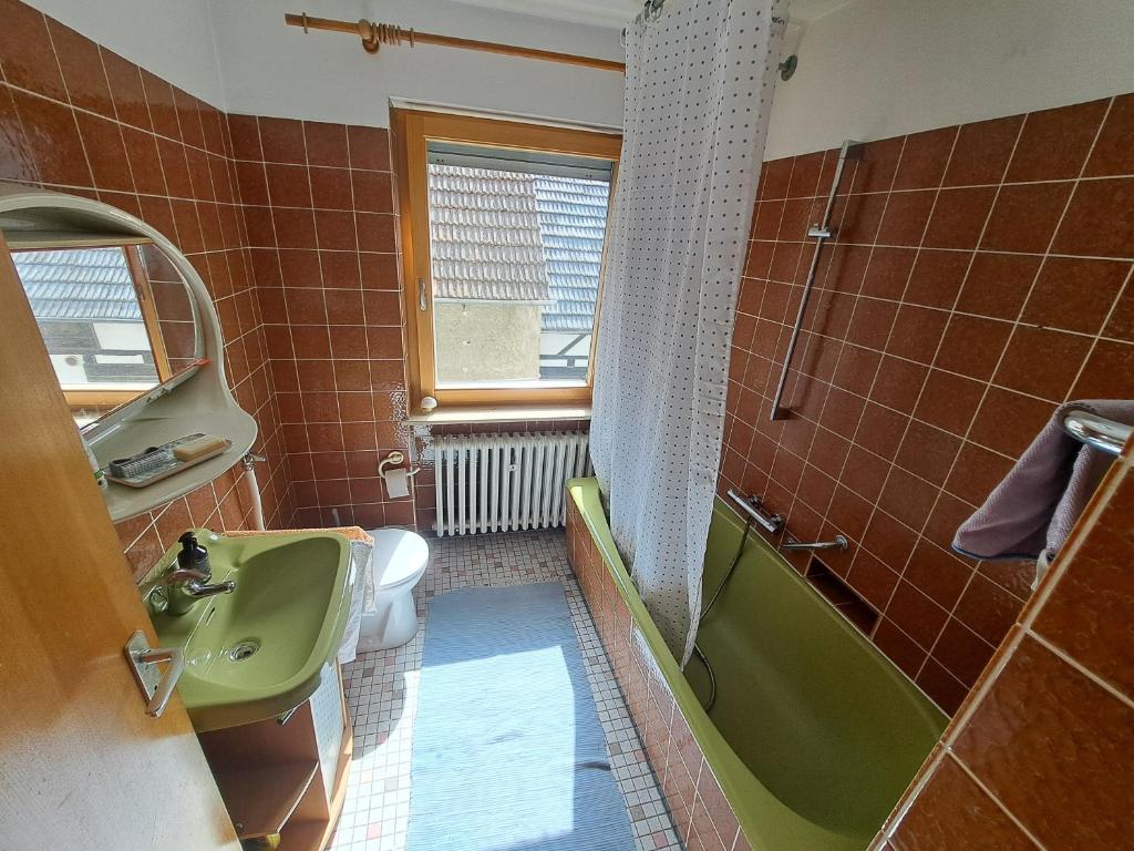 Koupelna v ubytování Einzelzimmer am Main