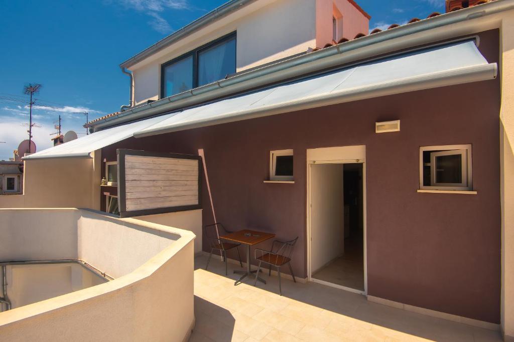 a view of a balcony of a house at D&A Amphitheatre Apartments with free parking in Pula