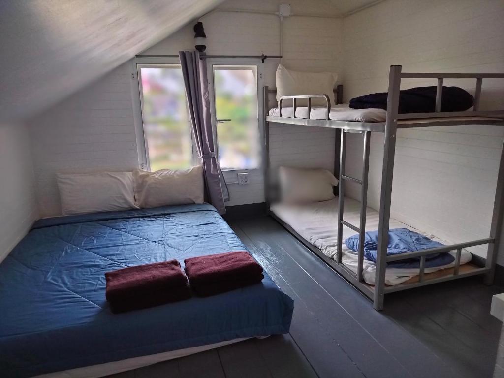 Postel nebo postele na pokoji v ubytování Na Na Doo Homestay