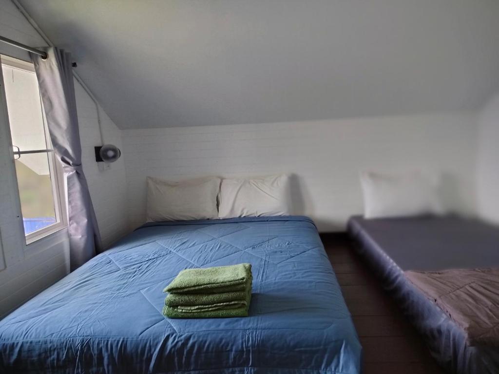 Postel nebo postele na pokoji v ubytování Na Na Doo Homestay