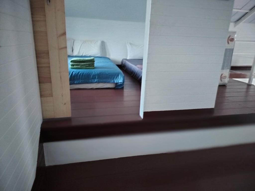Postel nebo postele na pokoji v ubytování Na Na Doo Homestay