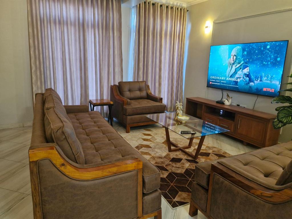 TV a/nebo společenská místnost v ubytování Mahogany Mine Apartments -2
