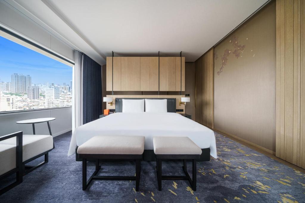 Postel nebo postele na pokoji v ubytování Hotel Nikko Kaohsiung