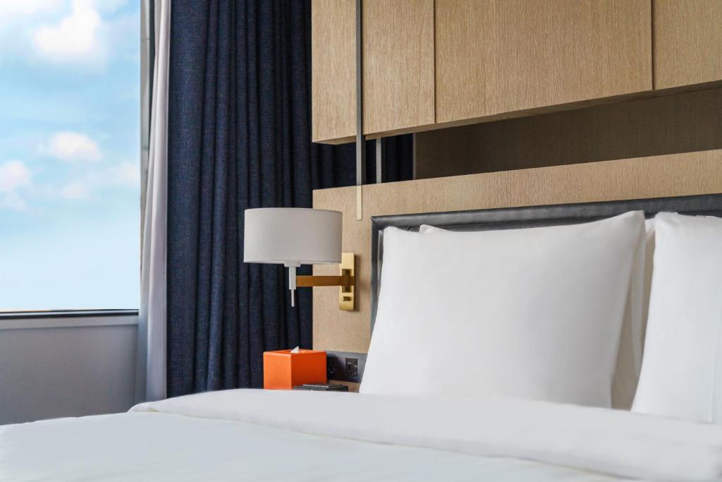 Postel nebo postele na pokoji v ubytování Hotel Nikko Kaohsiung