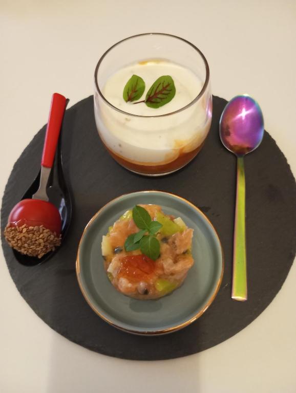 a plate of food with a dessert on a table at Le Mas Victoria - Chambres d'hôtes avec table d'hôtes-Parking privé ferme in Carcassonne