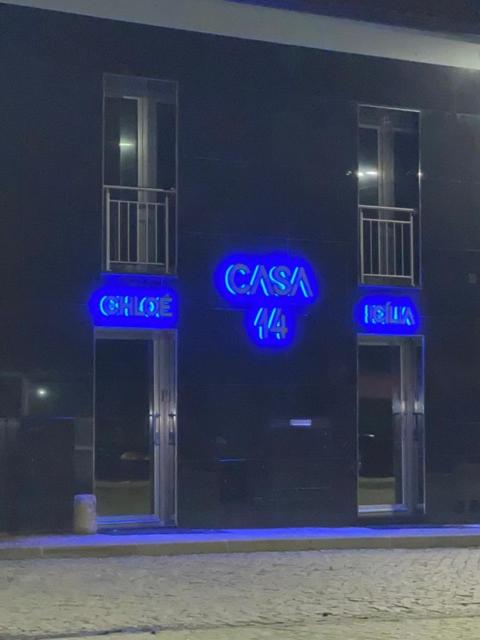 a building with blue signs on the side of it at Casa 14 in Sabugal