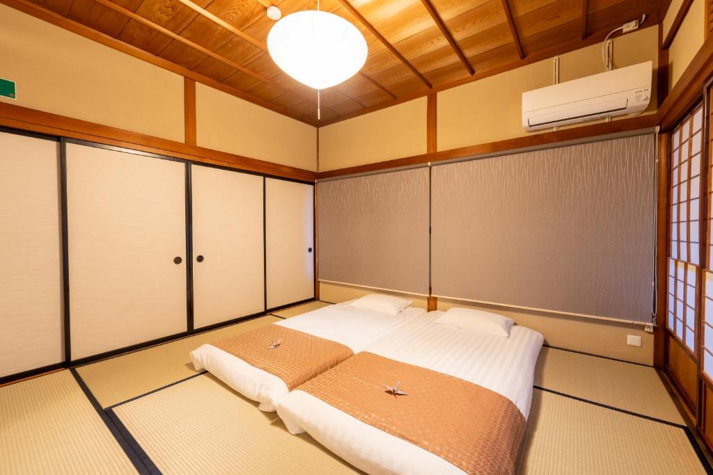 Postel nebo postele na pokoji v ubytování お宿一の華